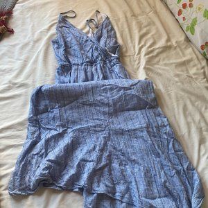 Blue wrap-style dress with hankerchief hem